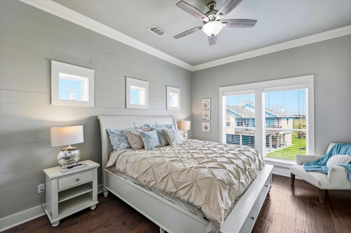 839 Eastview Crystal Beach, TX 77650 - Photo 23 of 44 a bedroom with a bed couch and a window