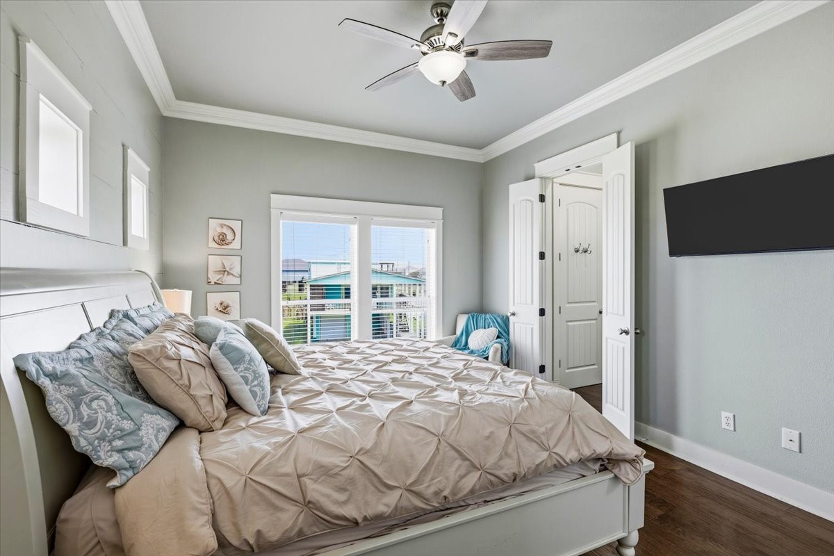 839 Eastview Crystal Beach, TX 77650 - Photo 24 of 44 a bed sitting in a bedroom next to a window