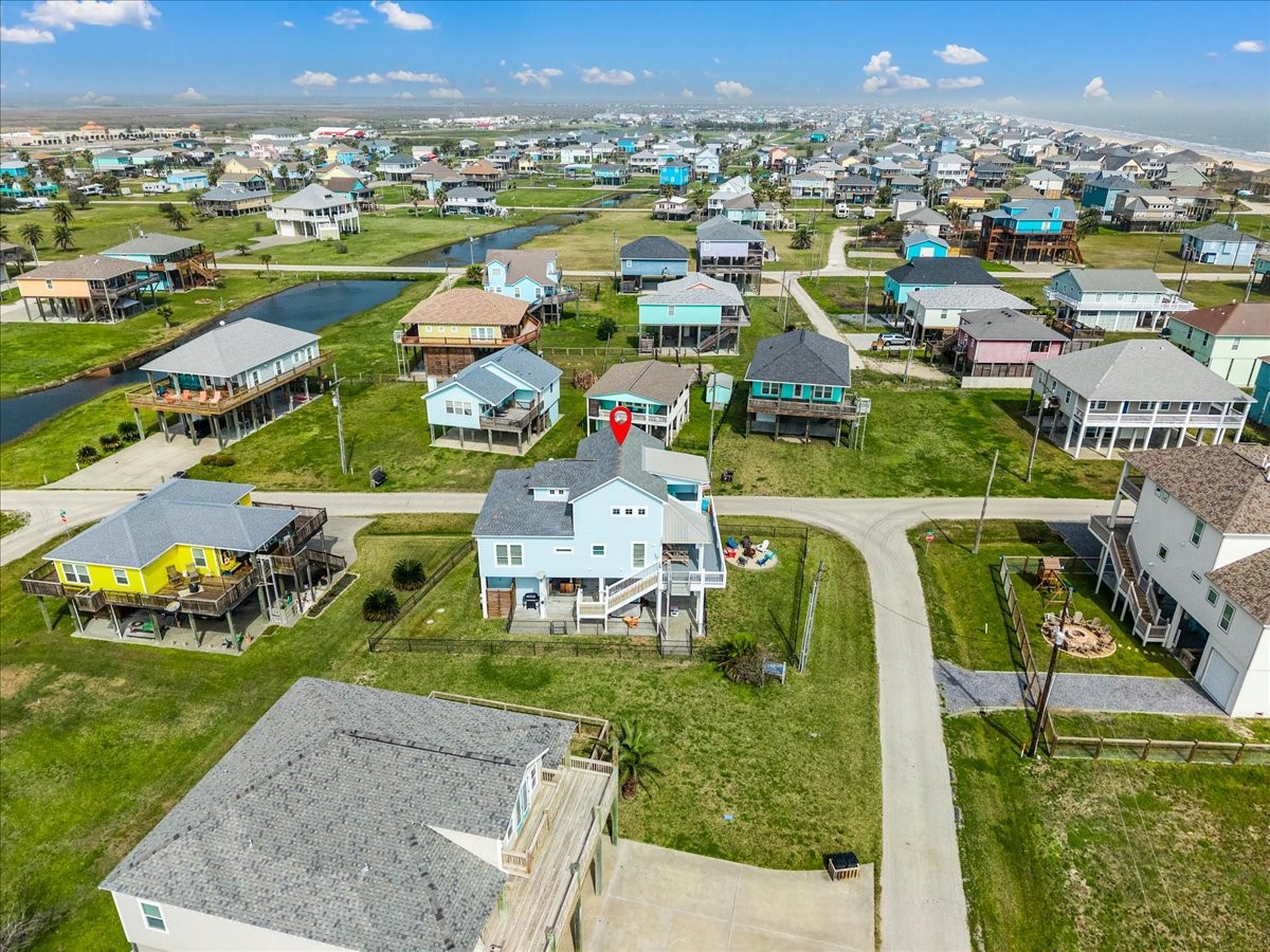 839 Eastview Crystal Beach, TX 77650 - Photo 43 of 44 an aerial view of residential houses with outdoor space and parking