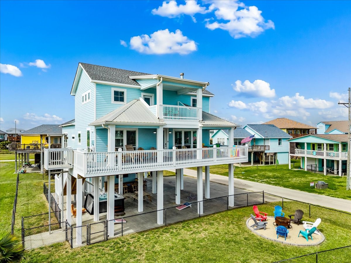 839 Eastview Crystal Beach, TX 77650 - Photo 44 of 44 a front view of a house with a yard table and chairs