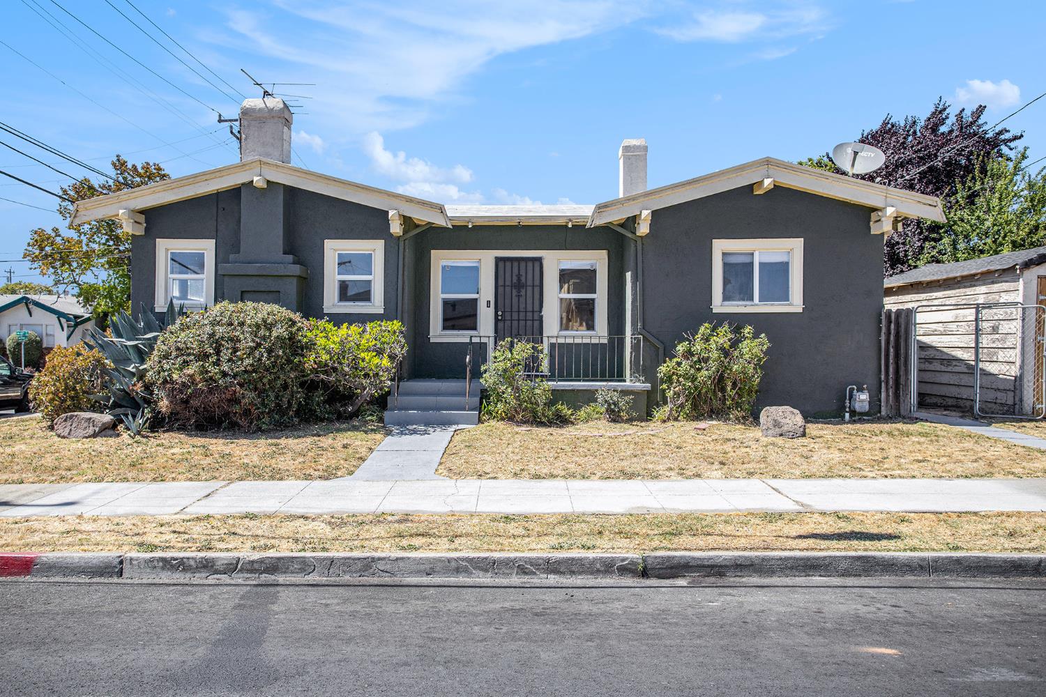 6718 Flora Street Oakland, CA 94621 - Photo 1 of 1 a view of a house with small yard plants and outdoor space