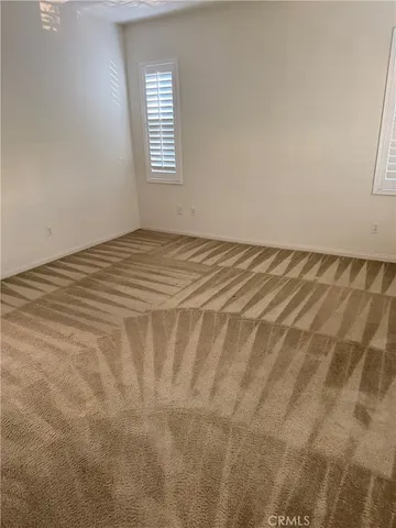 a view of a room with a bed