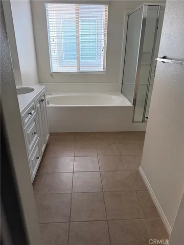 a bathroom with a bathtub a toilet and a shower