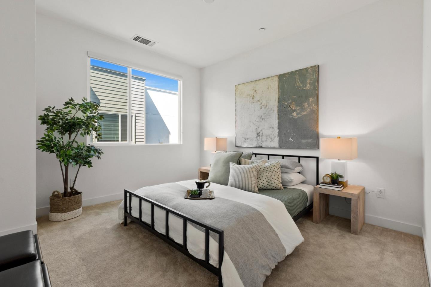 117 Uptown Circle Oakland, CA 94607 - Photo 12 of 25 a bedroom with bed and a potted plant