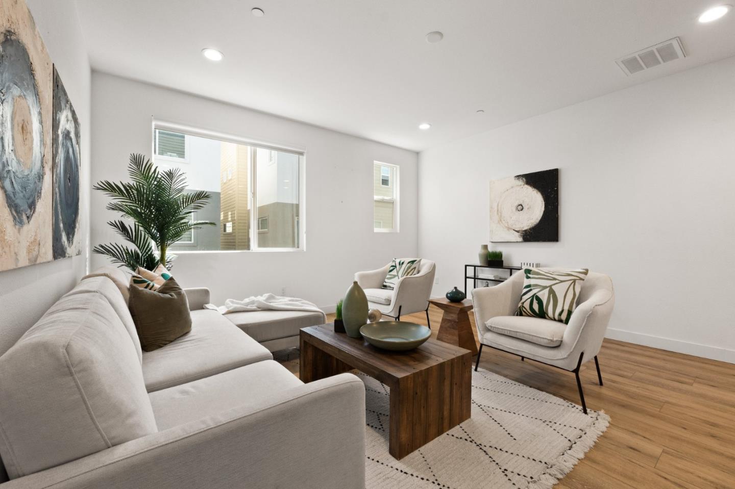 117 Uptown Circle Oakland, CA 94607 - Photo 6 of 25 a living room with furniture and a potted plant