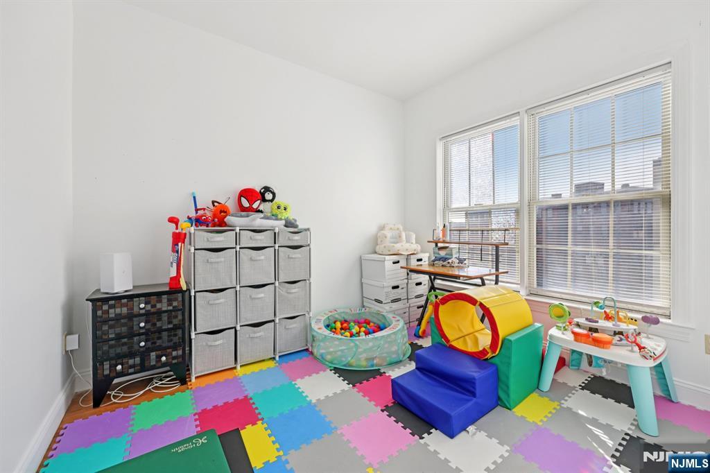 15 Tichenor Street, Unit 407 Newark, NJ 07102 - Photo 19 of 26 a soccer room with lots of baby toys and toys