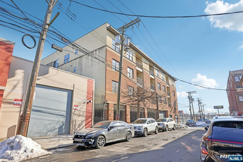 15 Tichenor Street, Unit 407 Newark, NJ 07102 - Photo 2 of 26 a car parked in front of a building