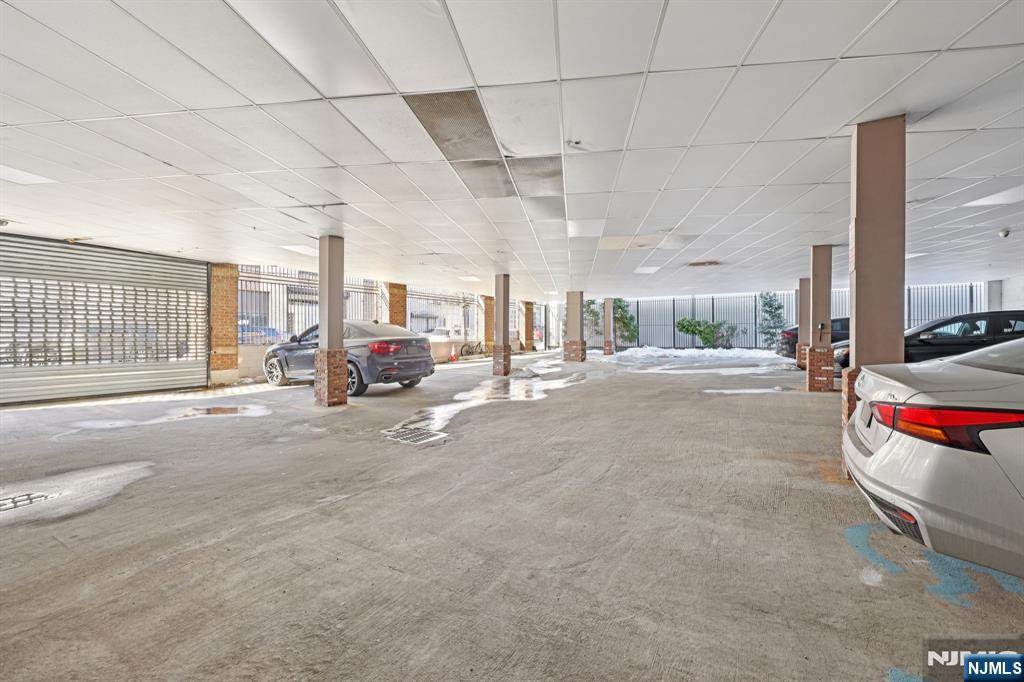 15 Tichenor Street, Unit 407 Newark, NJ 07102 - Photo 24 of 26 a living room with furniture and a chandelier