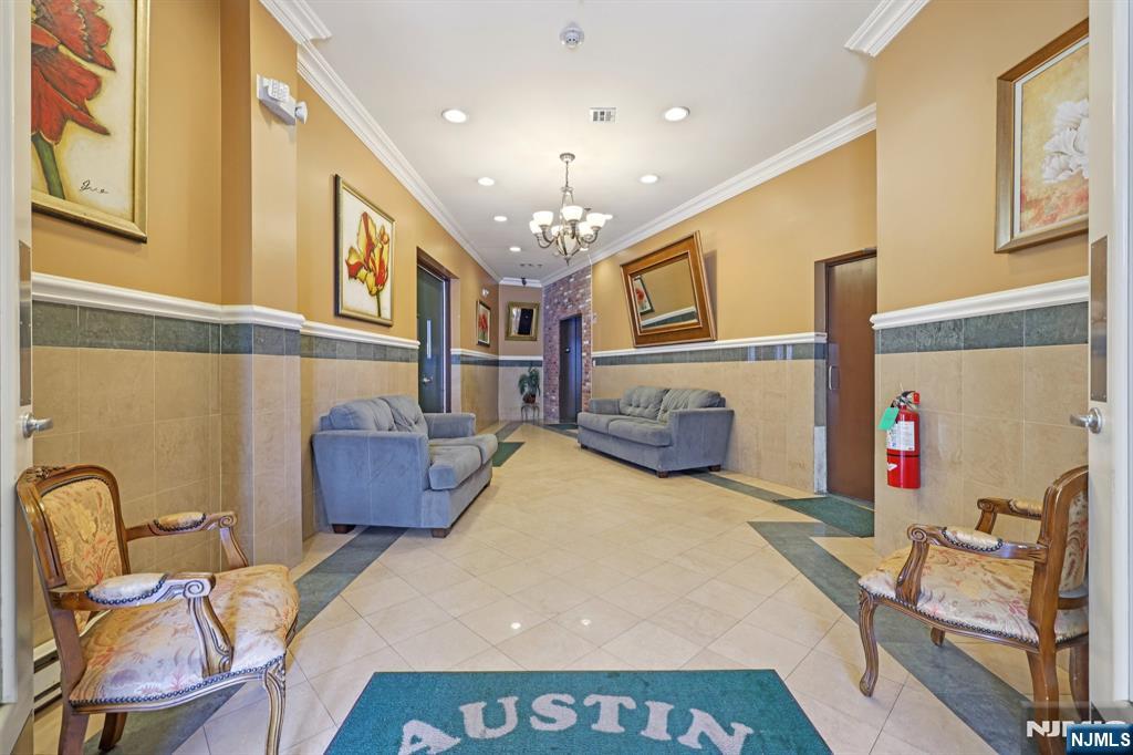 15 Tichenor Street, Unit 407 Newark, NJ 07102 - Photo 5 of 26 a view of a livingroom with furniture and windows