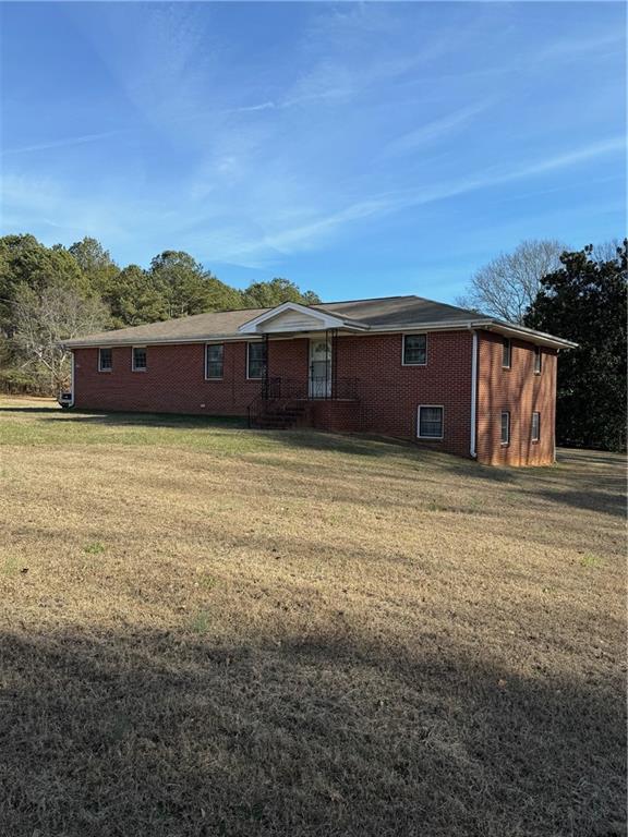 592 Hoke O'Kelly Mill Road Southwest Loganville, GA 30052 - Photo 1 of 1 a view of a terrace