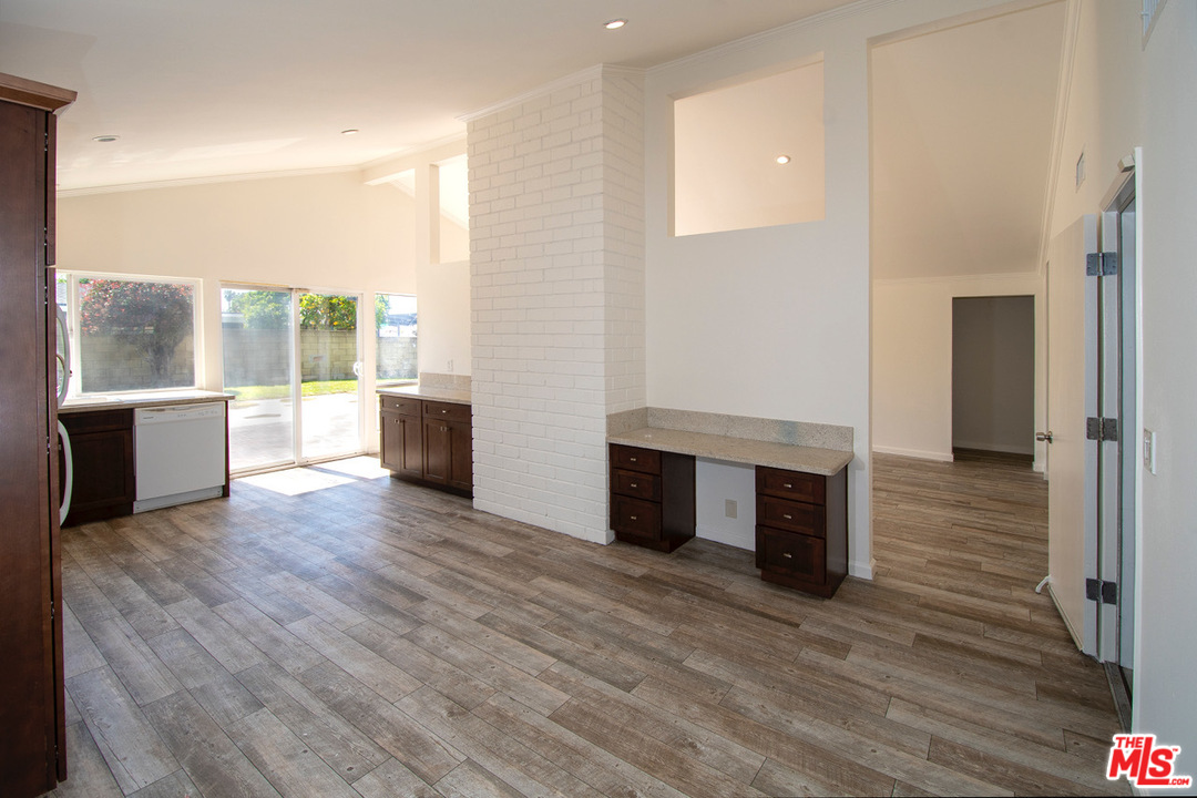 1238 Sultan Circle Carson, CA 90746 - Photo 11 of 18 a view of a living room with a fireplace and wooden floor