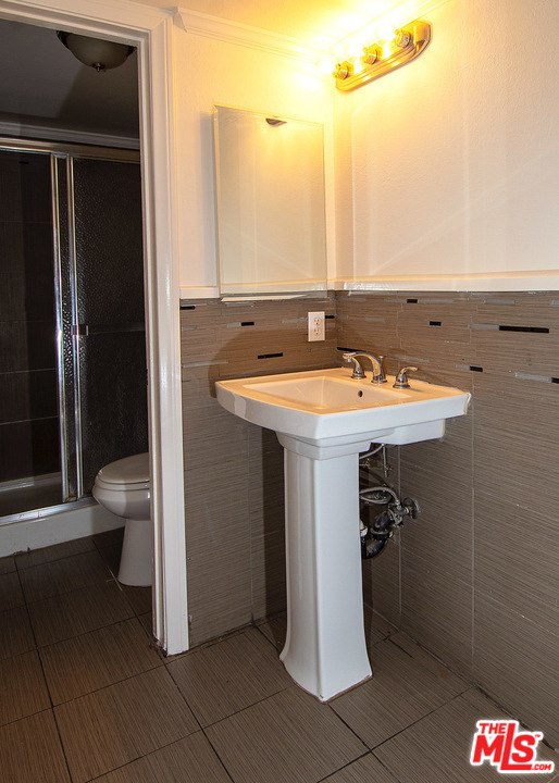 1238 Sultan Circle Carson, CA 90746 - Photo 9 of 18 a bathroom with a sink and a toilet