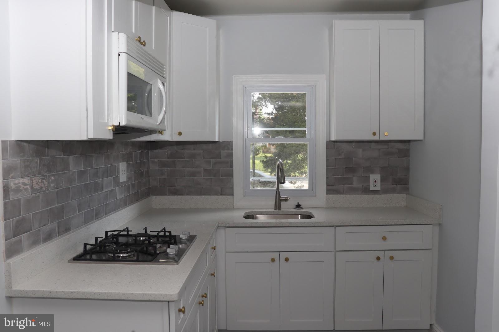 8400 Liberty Road Baltimore, MD 21244 - Photo 13 of 32 a kitchen with a sink and cabinets