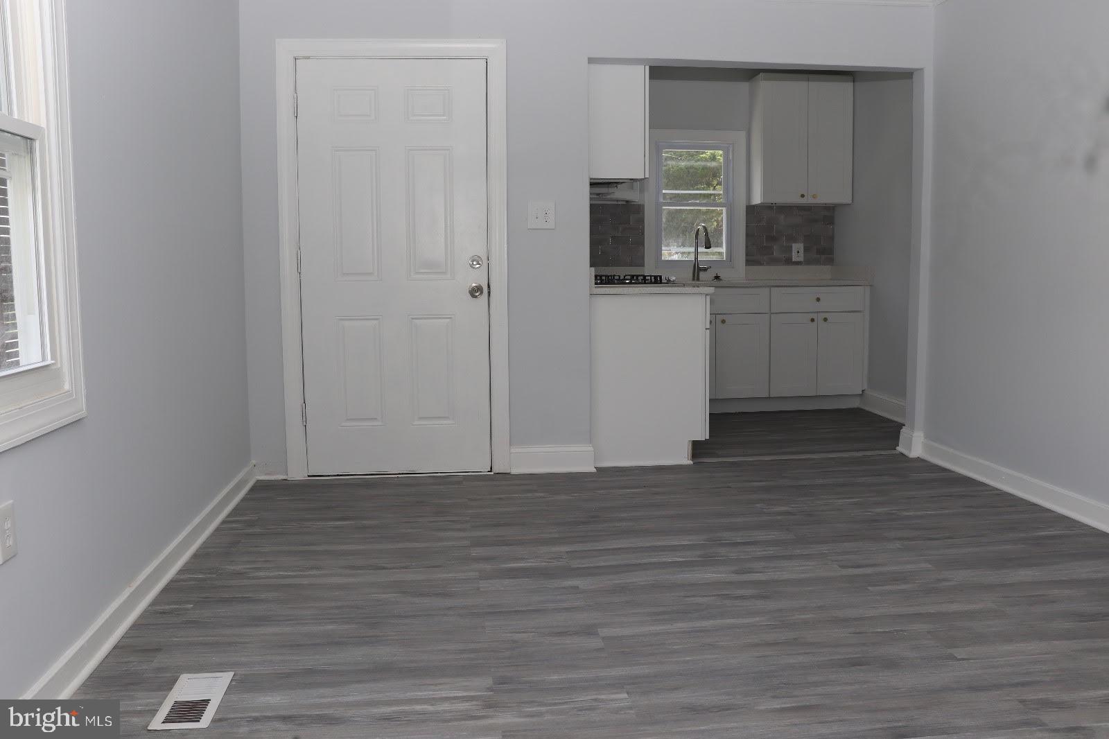 8400 Liberty Road Baltimore, MD 21244 - Photo 15 of 32 a view of a kitchen from the hallway with a sink