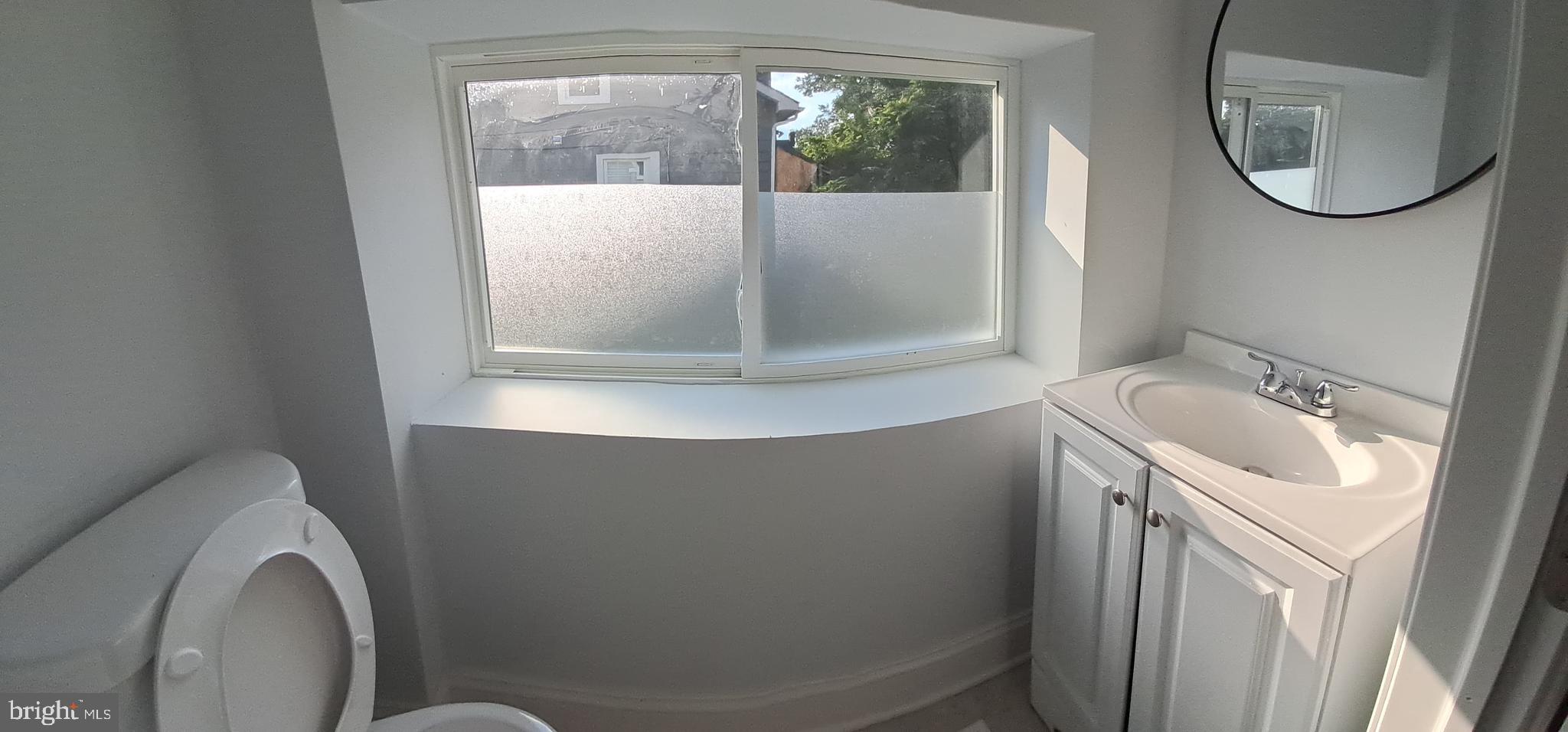 8400 Liberty Road Baltimore, MD 21244 - Photo 25 of 32 a bathroom with a sink and mirror