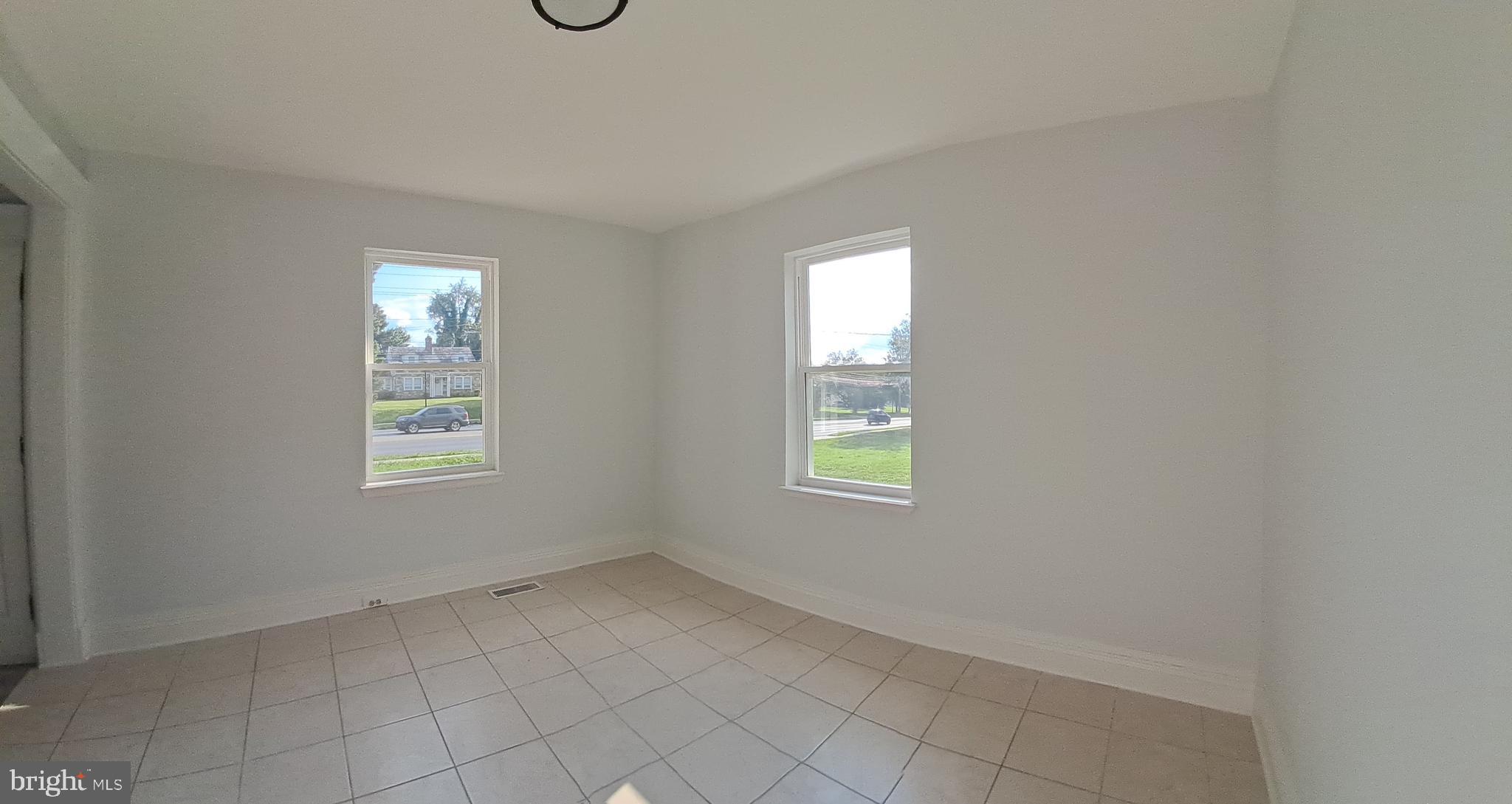 8400 Liberty Road Baltimore, MD 21244 - Photo 26 of 32 an empty room with windows