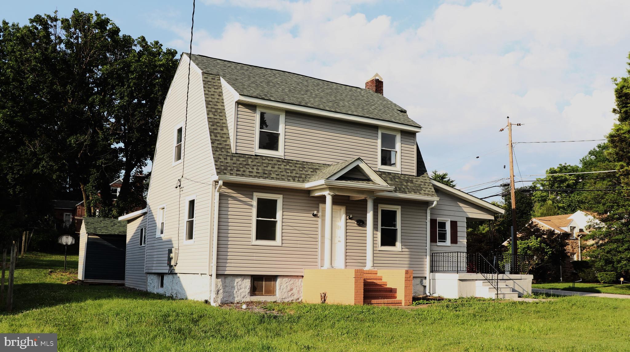8400 Liberty Road Baltimore, MD 21244 - Photo 30 of 32 a front view of a house with a garden