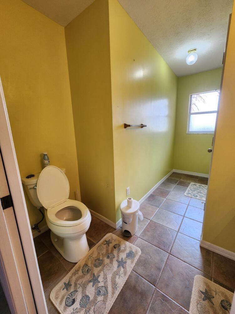 1177 Lisa Lane Okeechobee, FL 34974 - Photo 16 of 22 a bathroom with a sink and a toilet