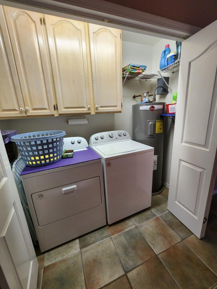 1177 Lisa Lane Okeechobee, FL 34974 - Photo 17 of 22 a utility room with cabinets washer and dryer