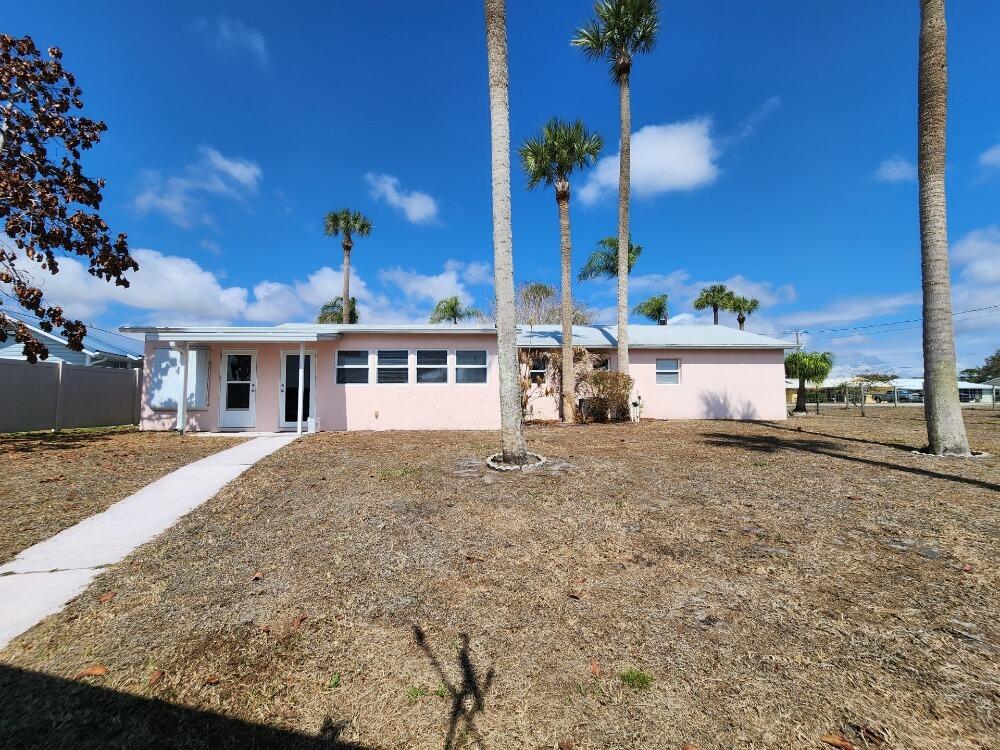 1177 Lisa Lane Okeechobee, FL 34974 - Photo 18 of 22 front view of a house with a yard