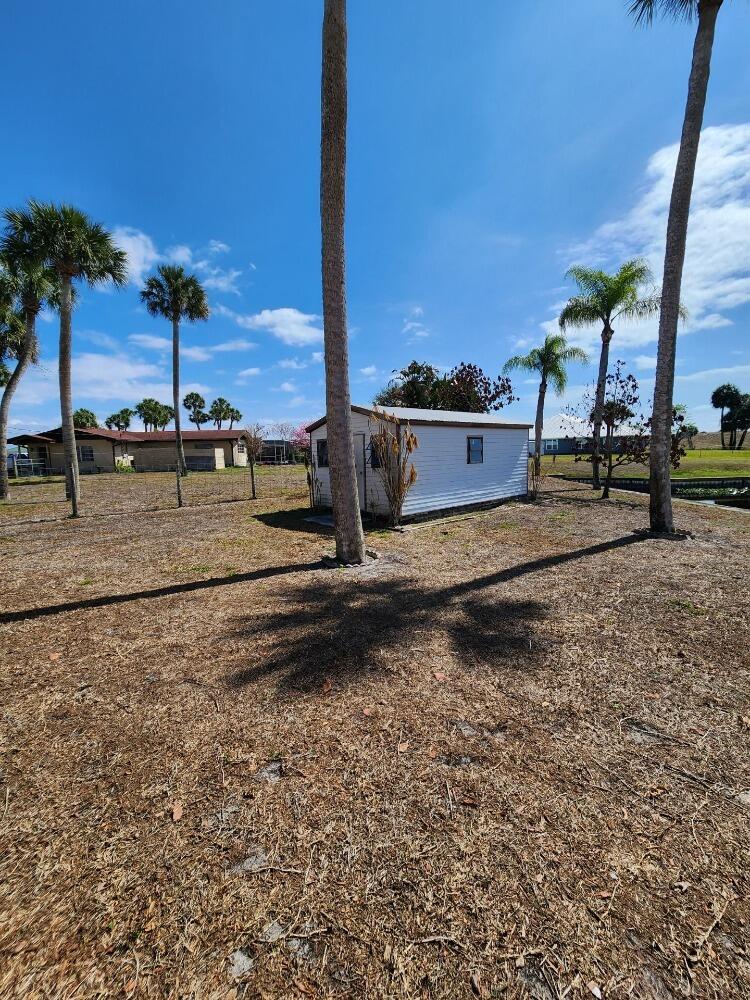 1177 Lisa Lane Okeechobee, FL 34974 - Photo 22 of 22 a view of a road with a yard