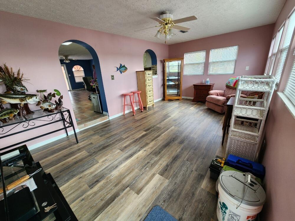1177 Lisa Lane Okeechobee, FL 34974 - Photo 6 of 22 a living room with furniture and wooden floor