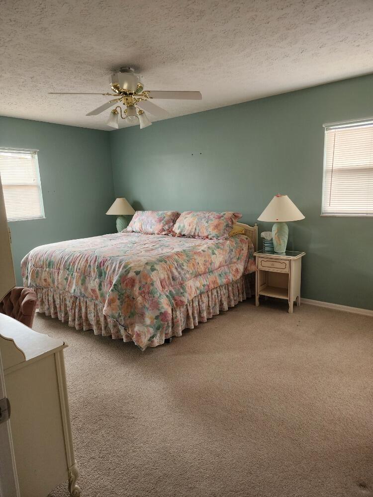 1177 Lisa Lane Okeechobee, FL 34974 - Photo 7 of 22 a bedroom with bed and window