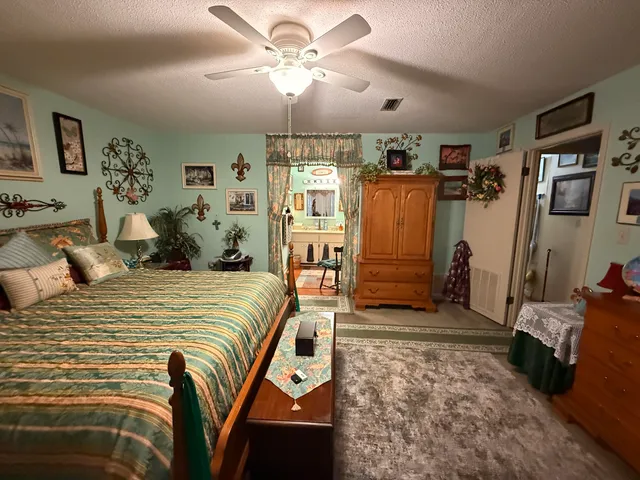 a bedroom with a bed and a mirror