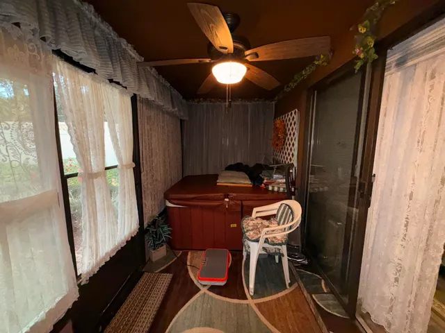 a view of a hallway with furniture and stairs