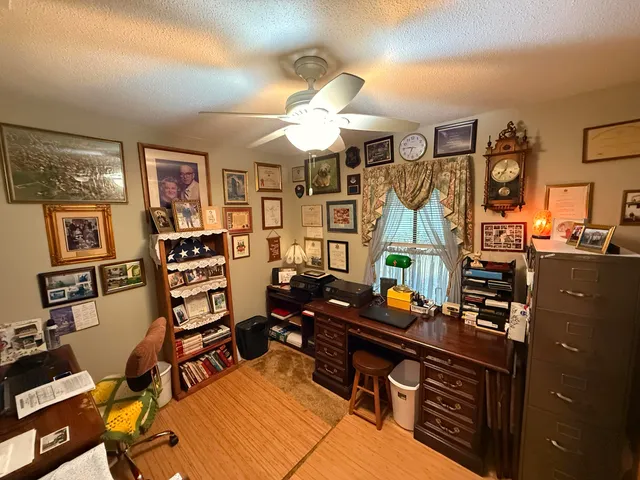 a bedroom with furniture and a chandelier