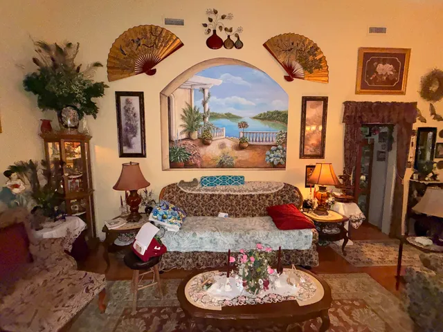 a living room with furniture and a fireplace