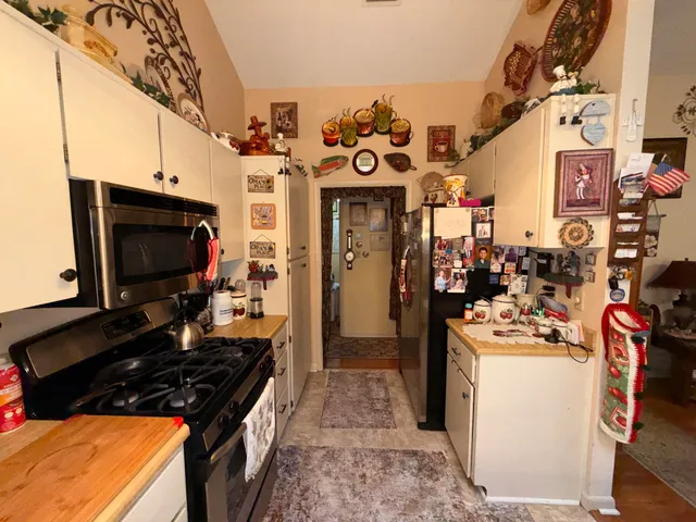 a kitchen with a stove and a microwave