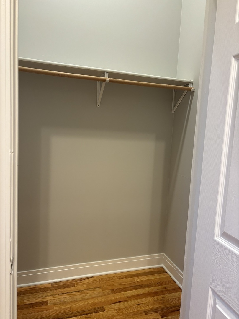 2002 West Chicago Avenue, Unit 2R Chicago, IL 60622 - Photo 15 of 17 a view of a room with racks on the wall