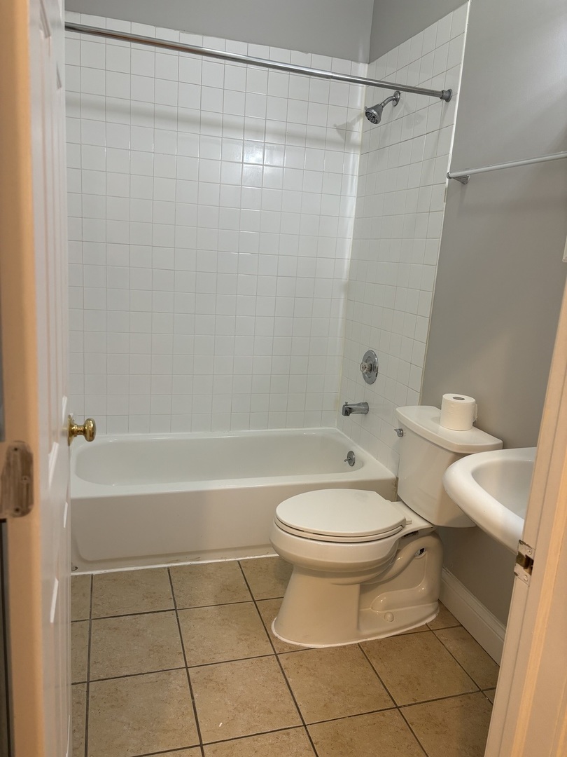 2002 West Chicago Avenue, Unit 2R Chicago, IL 60622 - Photo 16 of 17 a bathroom with a toilet and a shower