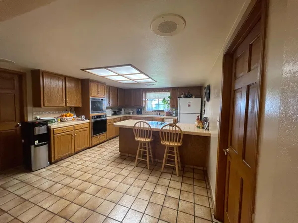 a kitchen with a sink cabinets and window
