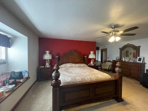 a living room with furniture and chandelier