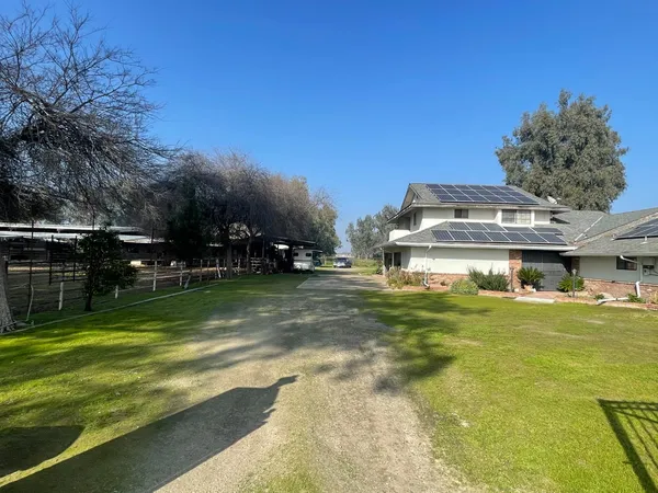 a view of a house with a big yard