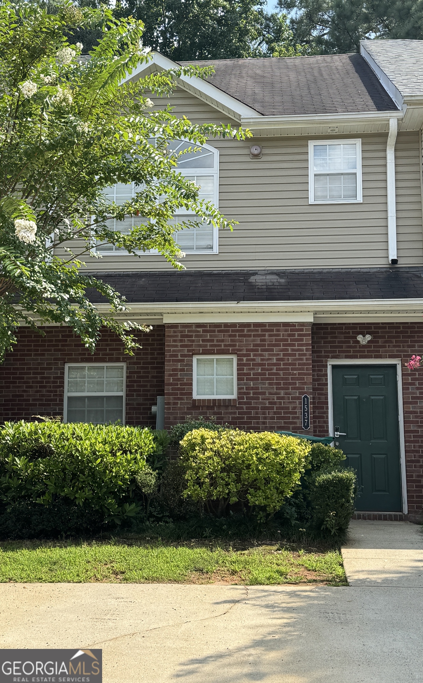 1537 Springleaf Cove Southeast Smyrna, GA 30080 - Photo 1 of 1 a front view of a house with a yard