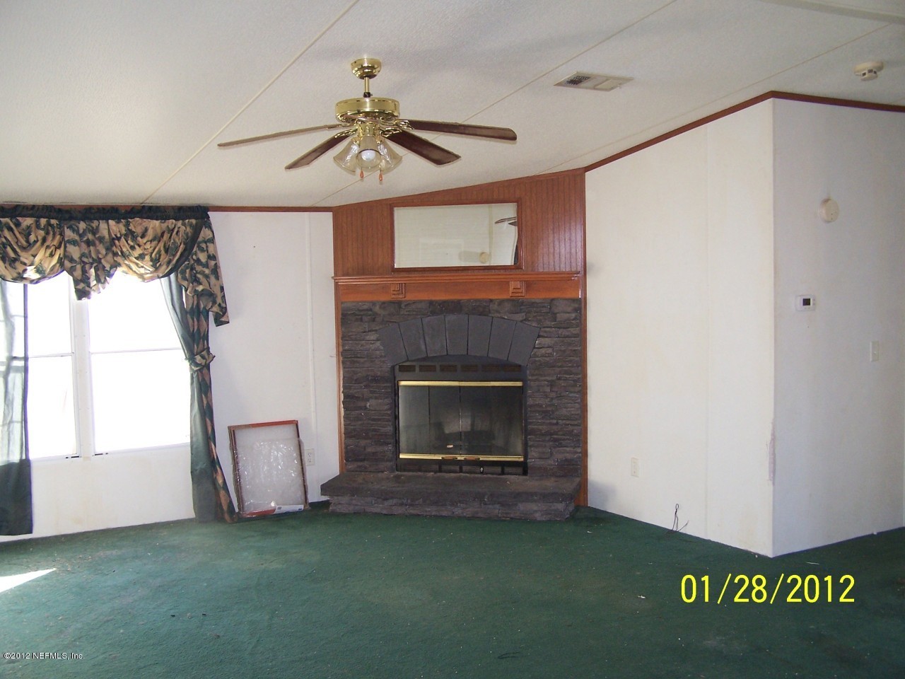 54264 Sherwood Road Callahan, FL 32011 - Photo 3 of 4 a living room with a fireplace