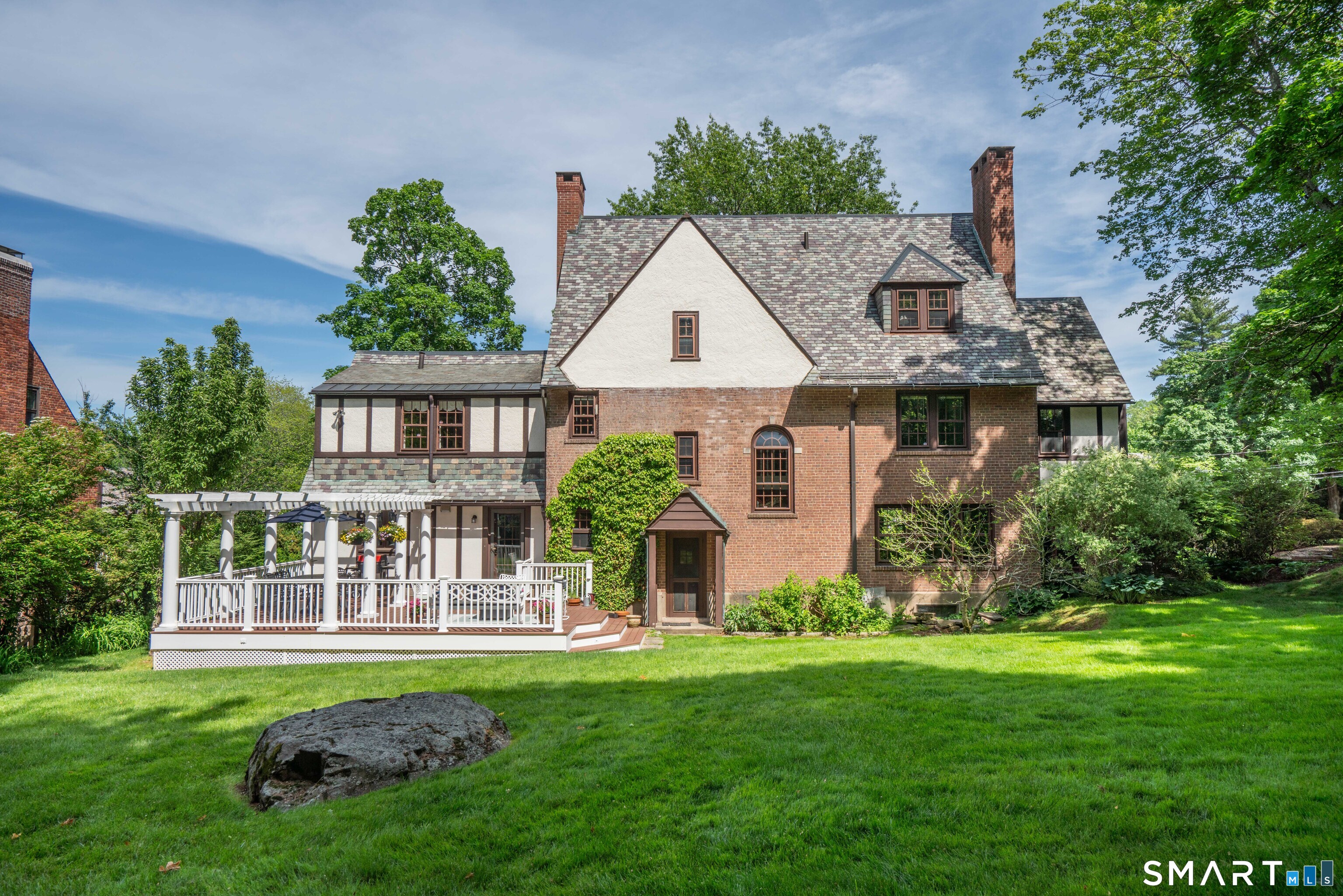 7 Fernwood Road West Hartford, CT 06119 - Photo 34 of 40 a front view of a house with a yard