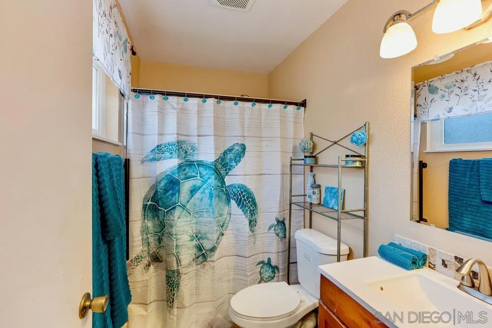 13358 Birch Tree Lane Poway, CA 92064 - Photo 13 of 16 a bathroom with a sink toilet and shower