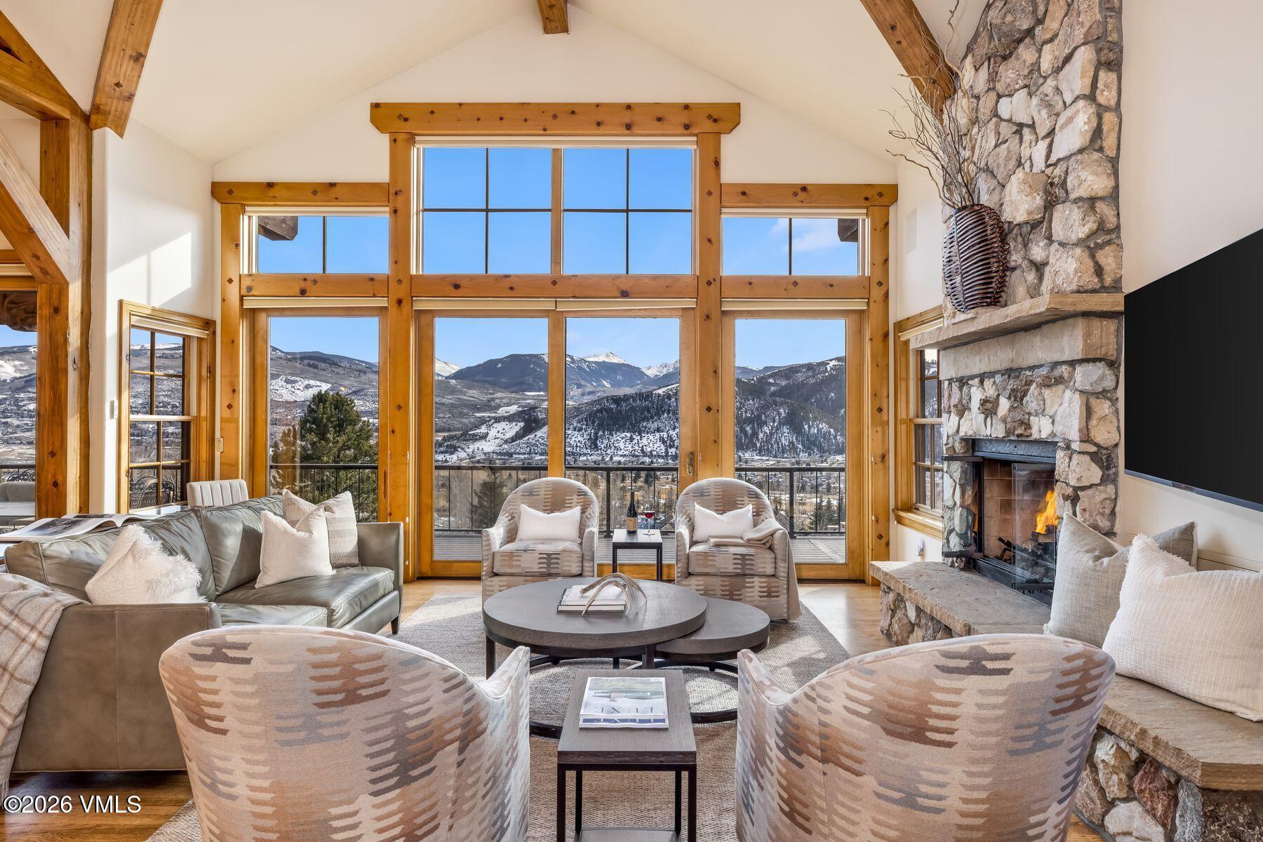 62 Elk Run Edwards, CO 81632 - Photo 15 of 43 a living room with fireplace furniture and a large window