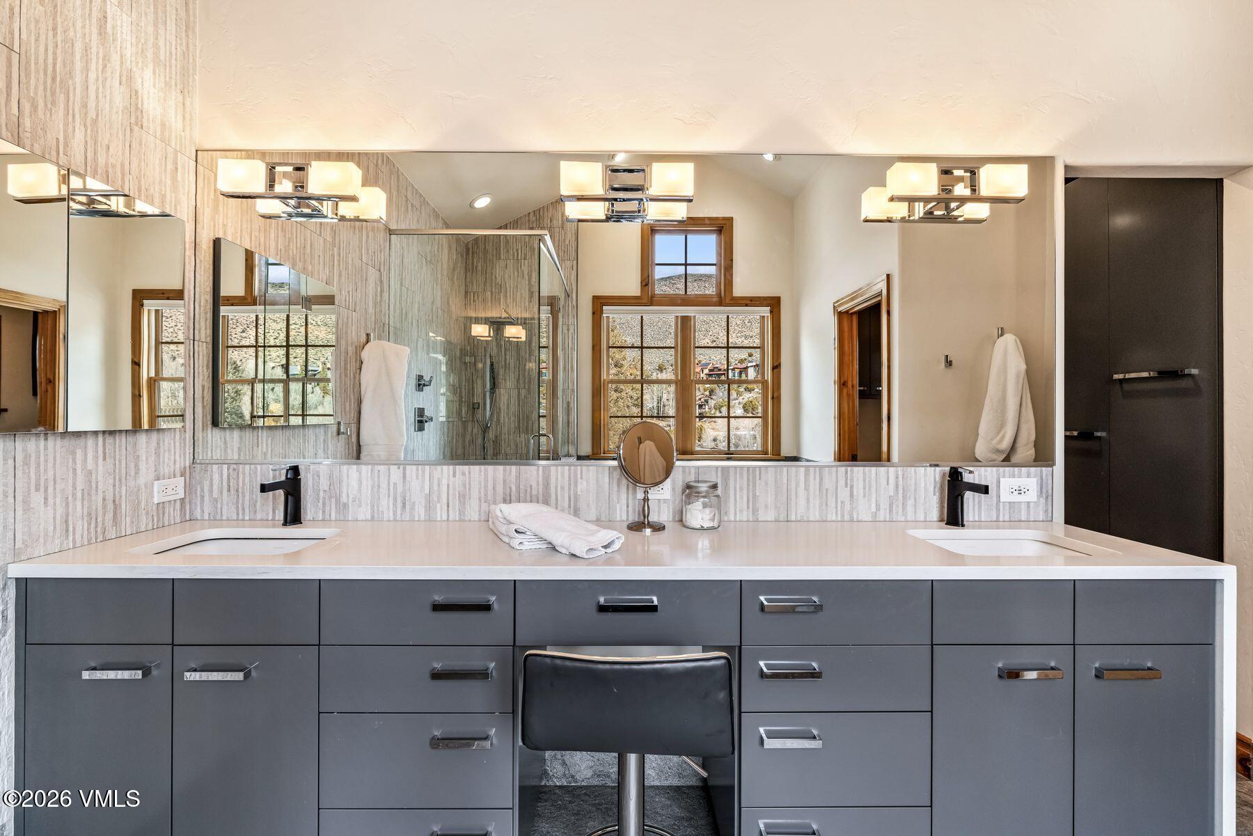 62 Elk Run Edwards, CO 81632 - Photo 23 of 43 a bathroom with a double vanity sink and a mirror