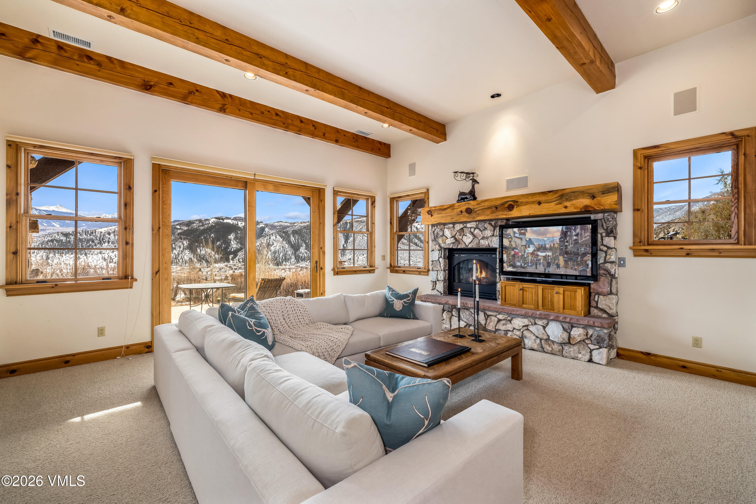 62 Elk Run Edwards, CO 81632 - Photo 24 of 43 a living room with fireplace furniture and a large window