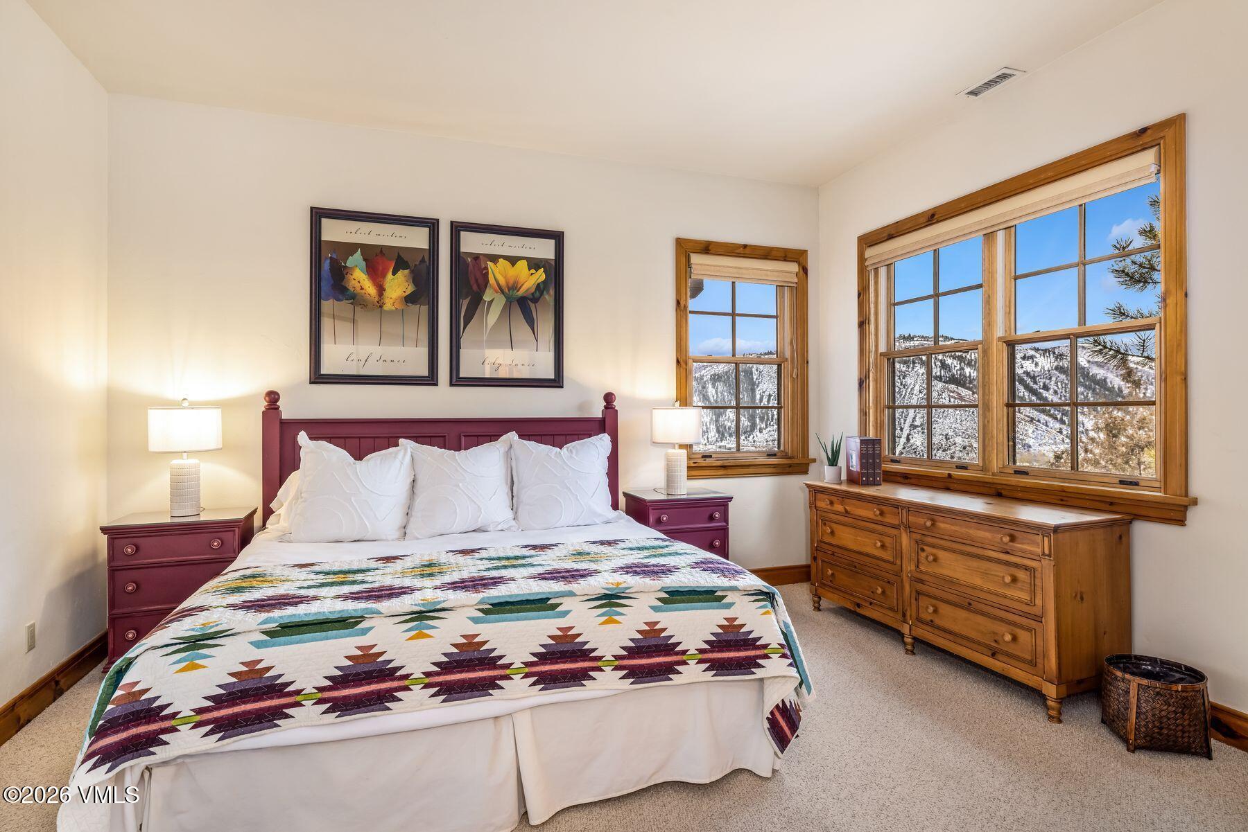 62 Elk Run Edwards, CO 81632 - Photo 27 of 43 a bedroom with a bed and a large window