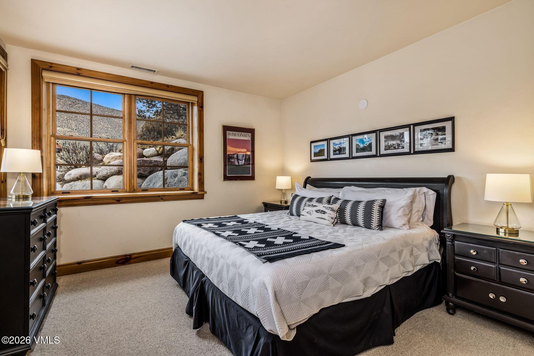 62 Elk Run Edwards, CO 81632 - Photo 30 of 43 a bedroom with a bed and a window