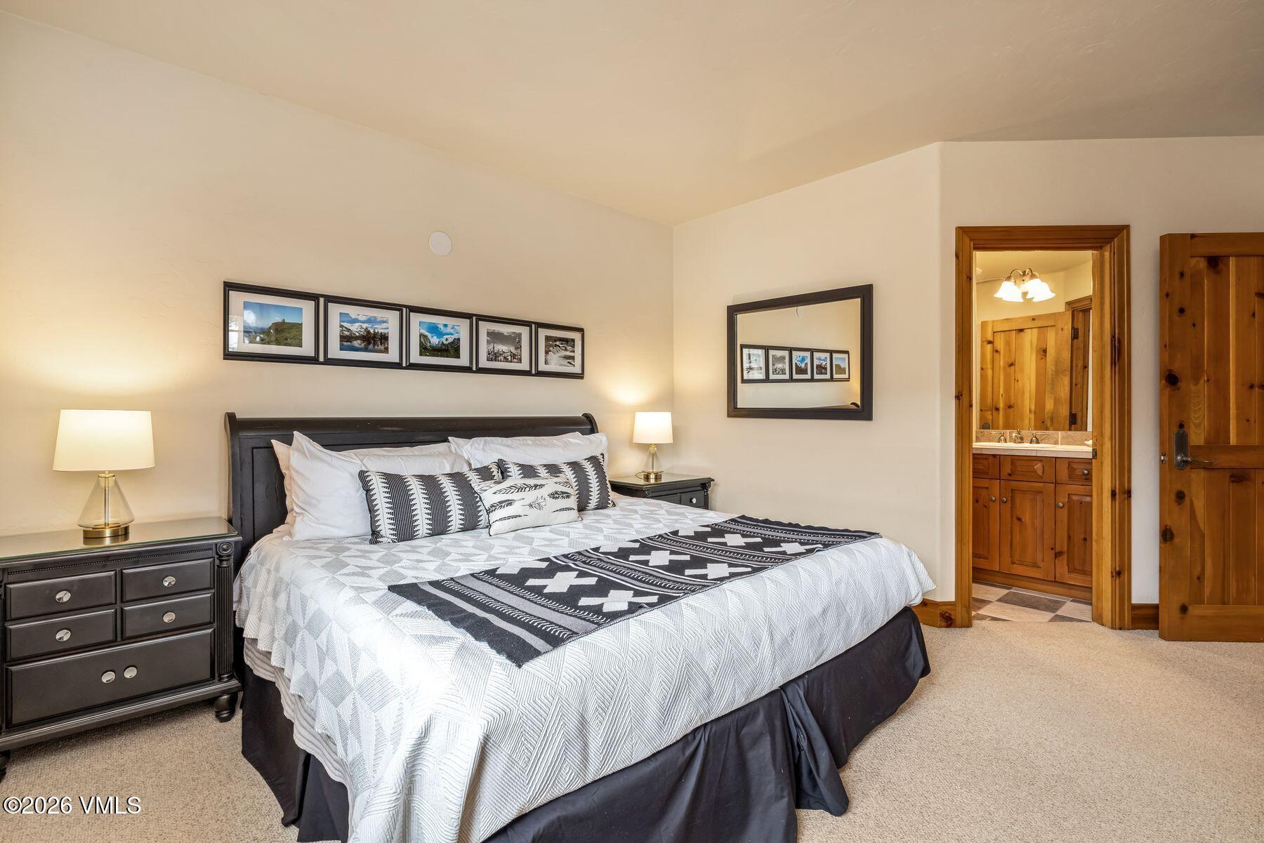 62 Elk Run Edwards, CO 81632 - Photo 31 of 43 a bedroom with a bed and a night stand