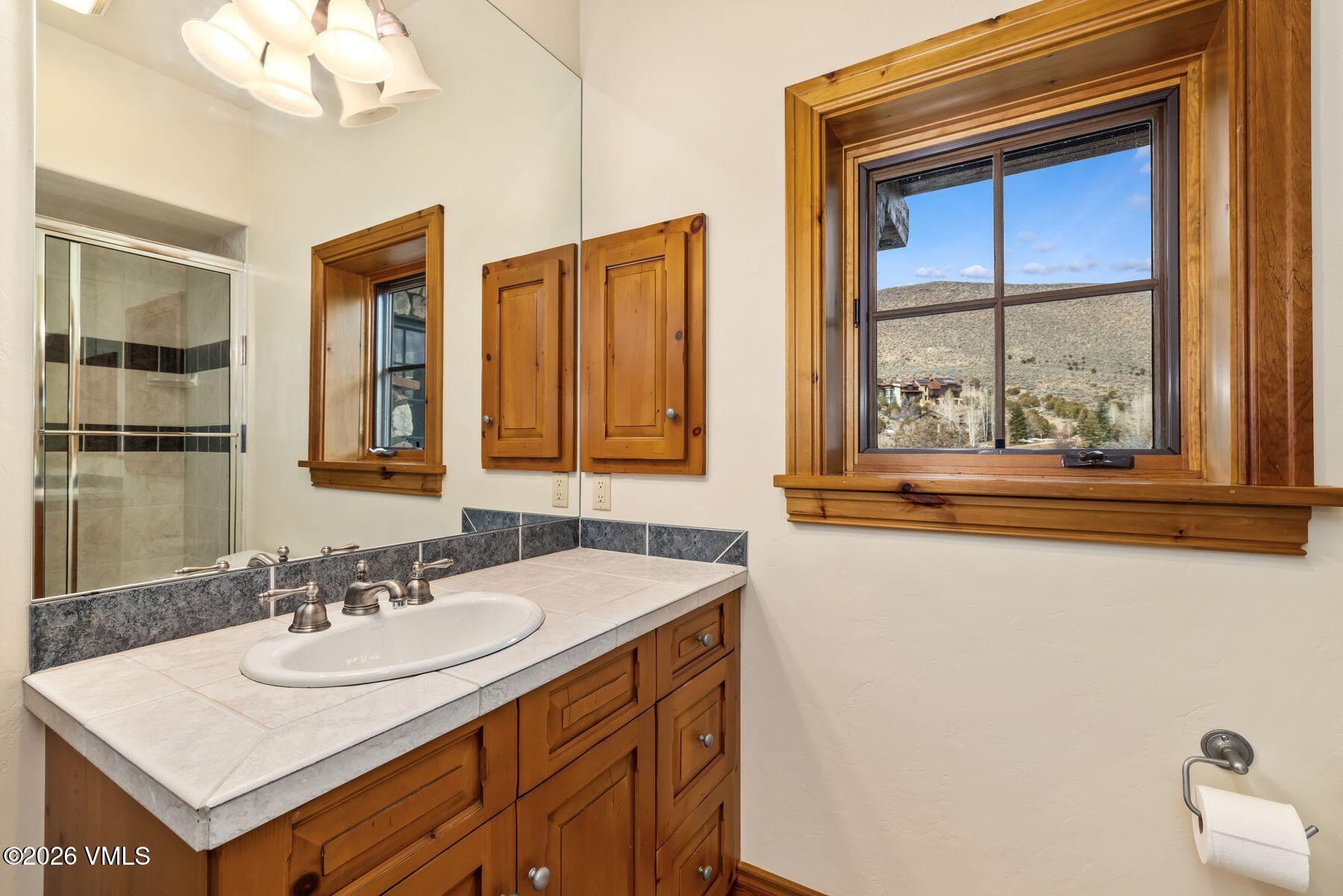 62 Elk Run Edwards, CO 81632 - Photo 35 of 43 a bathroom with a sink and a mirror