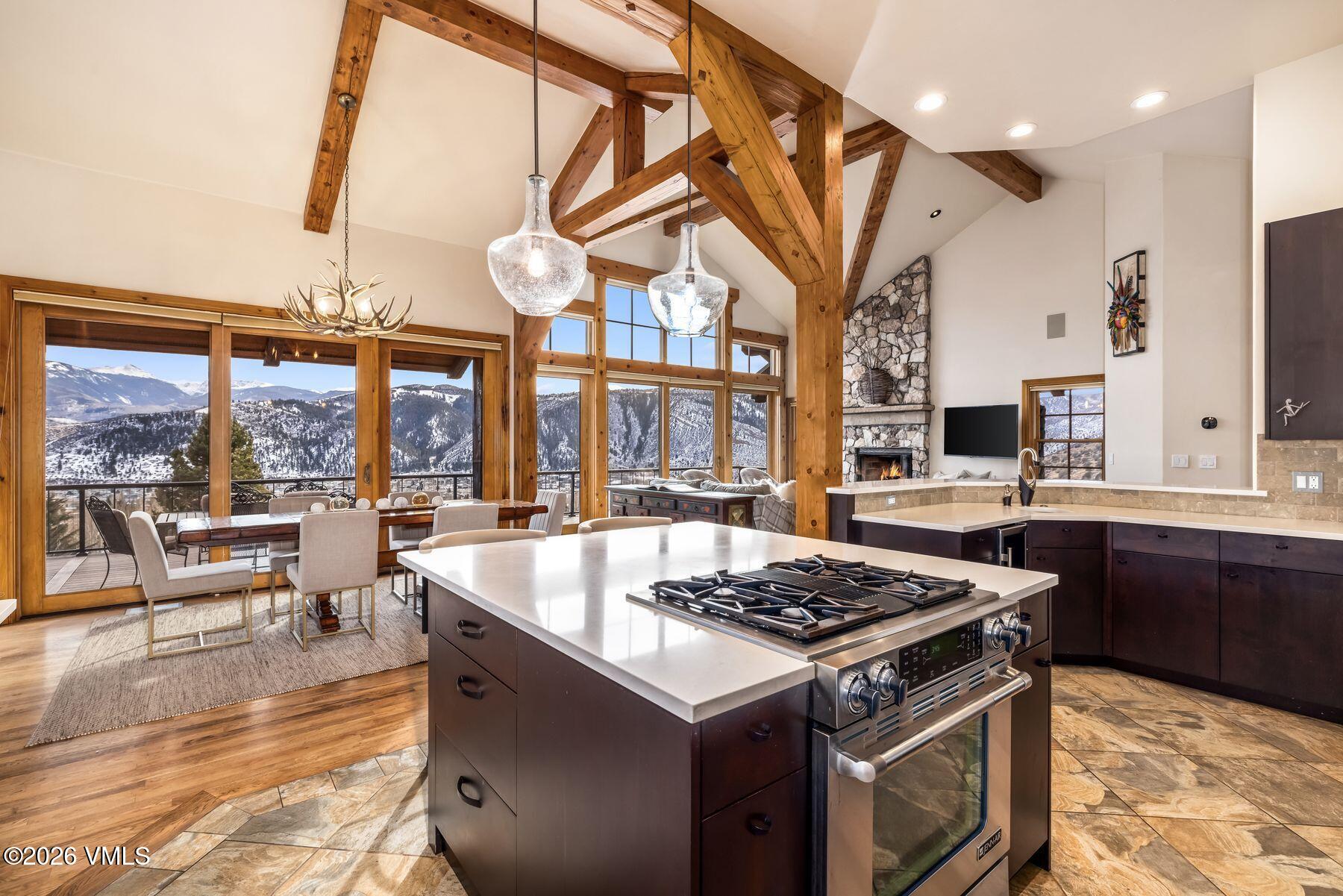 62 Elk Run Edwards, CO 81632 - Photo 5 of 43 a kitchen with stainless steel appliances granite countertop a stove and a view of living room