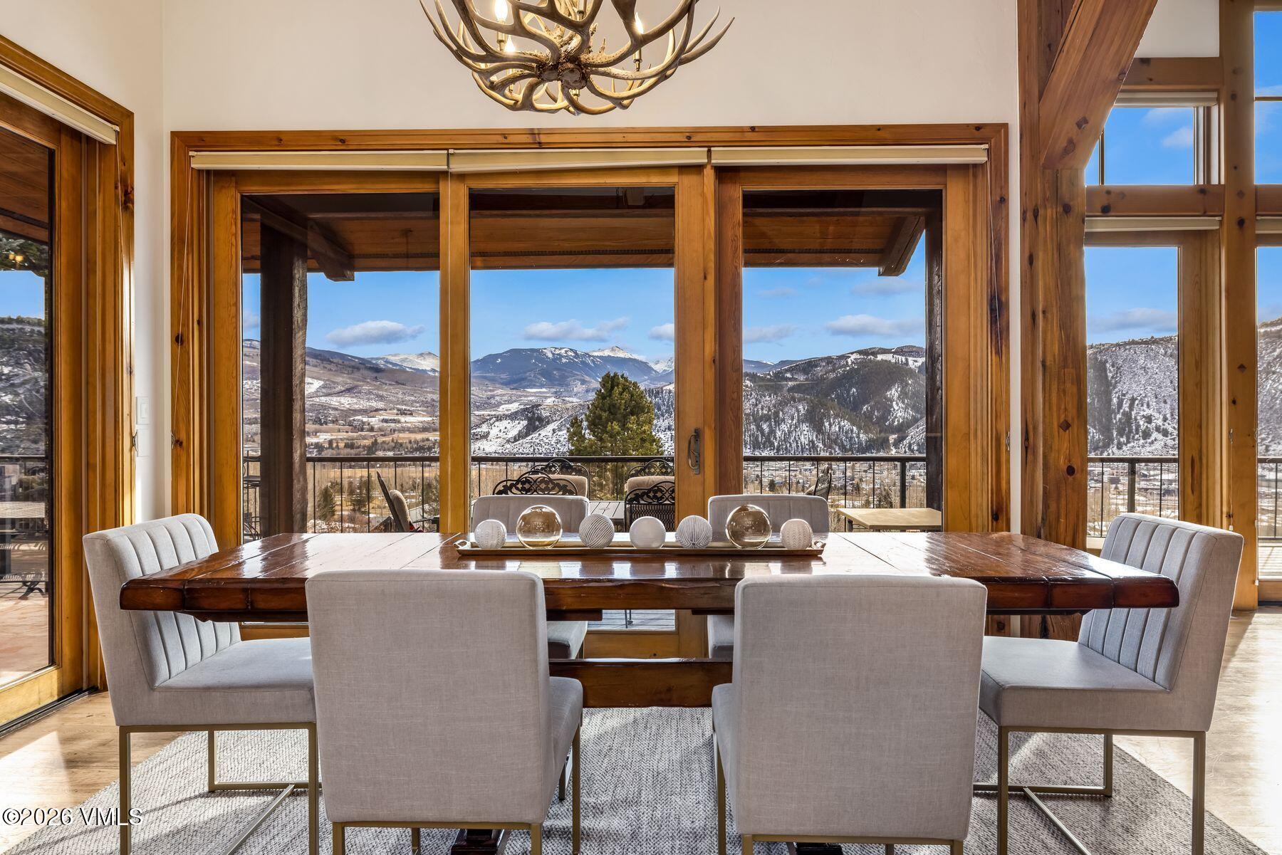 62 Elk Run Edwards, CO 81632 - Photo 6 of 43 a dining room with furniture a chandelier and a rug